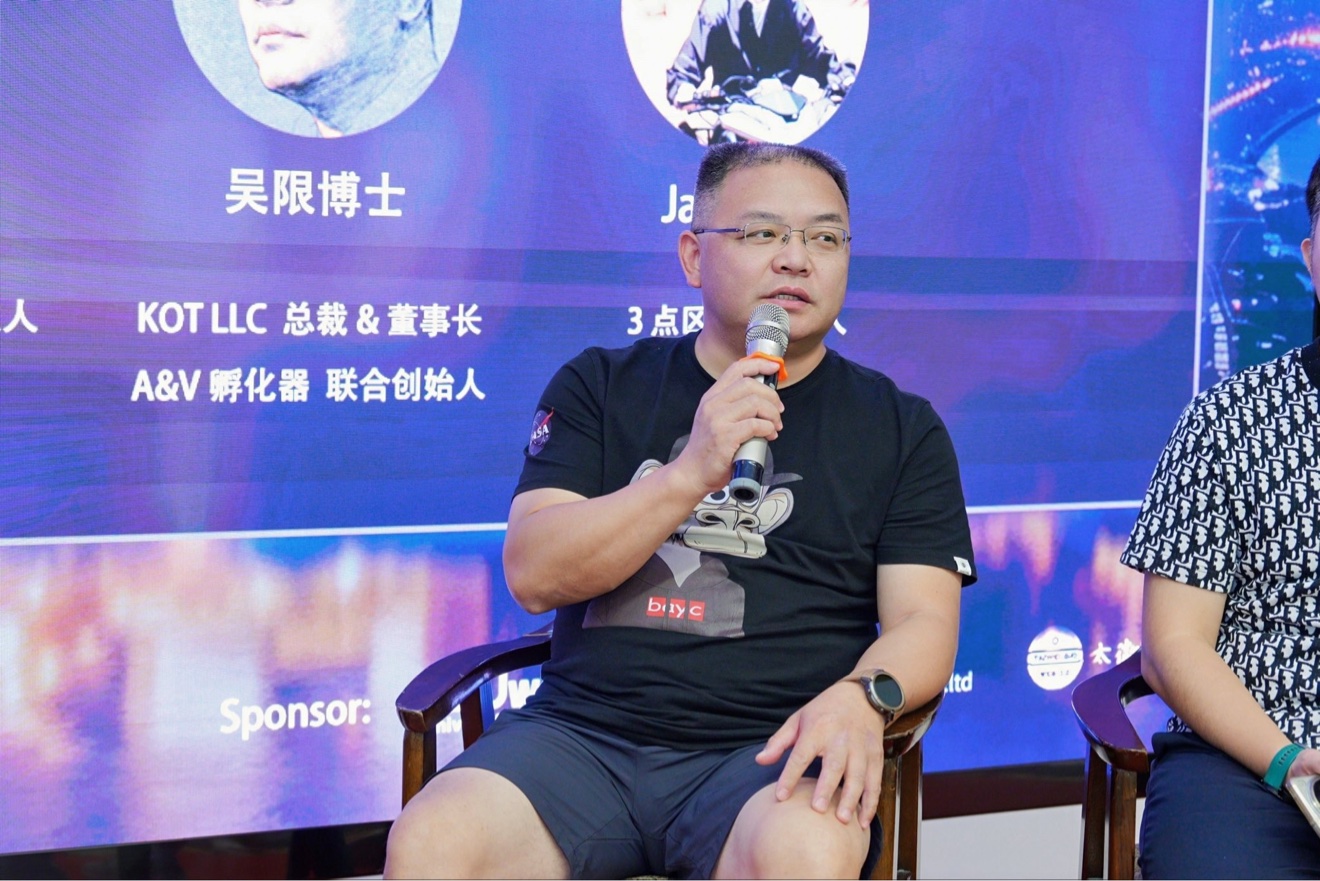 Dr. Xian Wu speaking into a microphone during the Shanghai roundtable